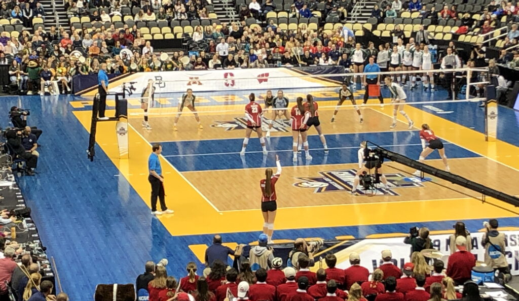 Two college women's volleyball teams playing in the NCAA Division I semi-finals in 2019