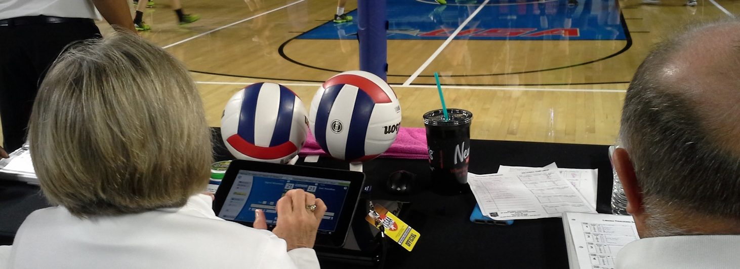 Woman using VolleyWrite Volleyball Scoring Software to score a volleyball match at the TSSAA state tournament.